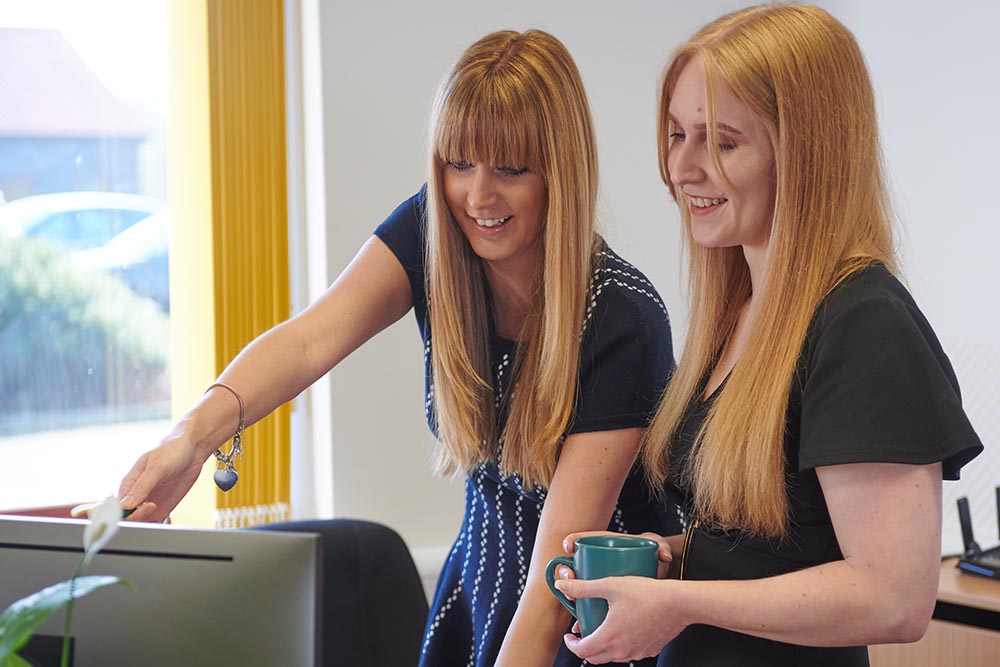 Stephanie and Hayley collaborative working at the MacKenzie King office